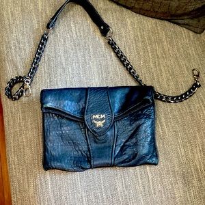 Black leather MCM clutch with strap